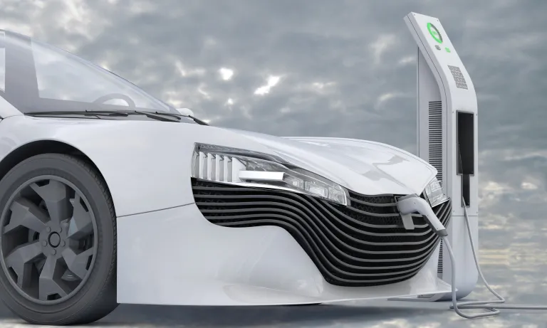 White car at charging station